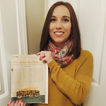 Stephanie holding copy of The Language Educator showing her article